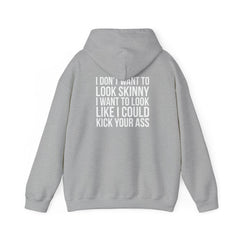 I DON’T WANT TO LOOK SKINNY, I WANT TO LOOK LIKE I CAN KICK YOUR ASS – Unisex Heavy Blend™ Hooded Sweatshirt (White Logo) 🤍