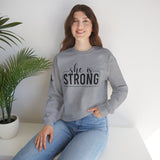 She is STRONG - Unisex Heavy Blend™ Crewneck Sweatshirt - Front Black Logo - Plain Back