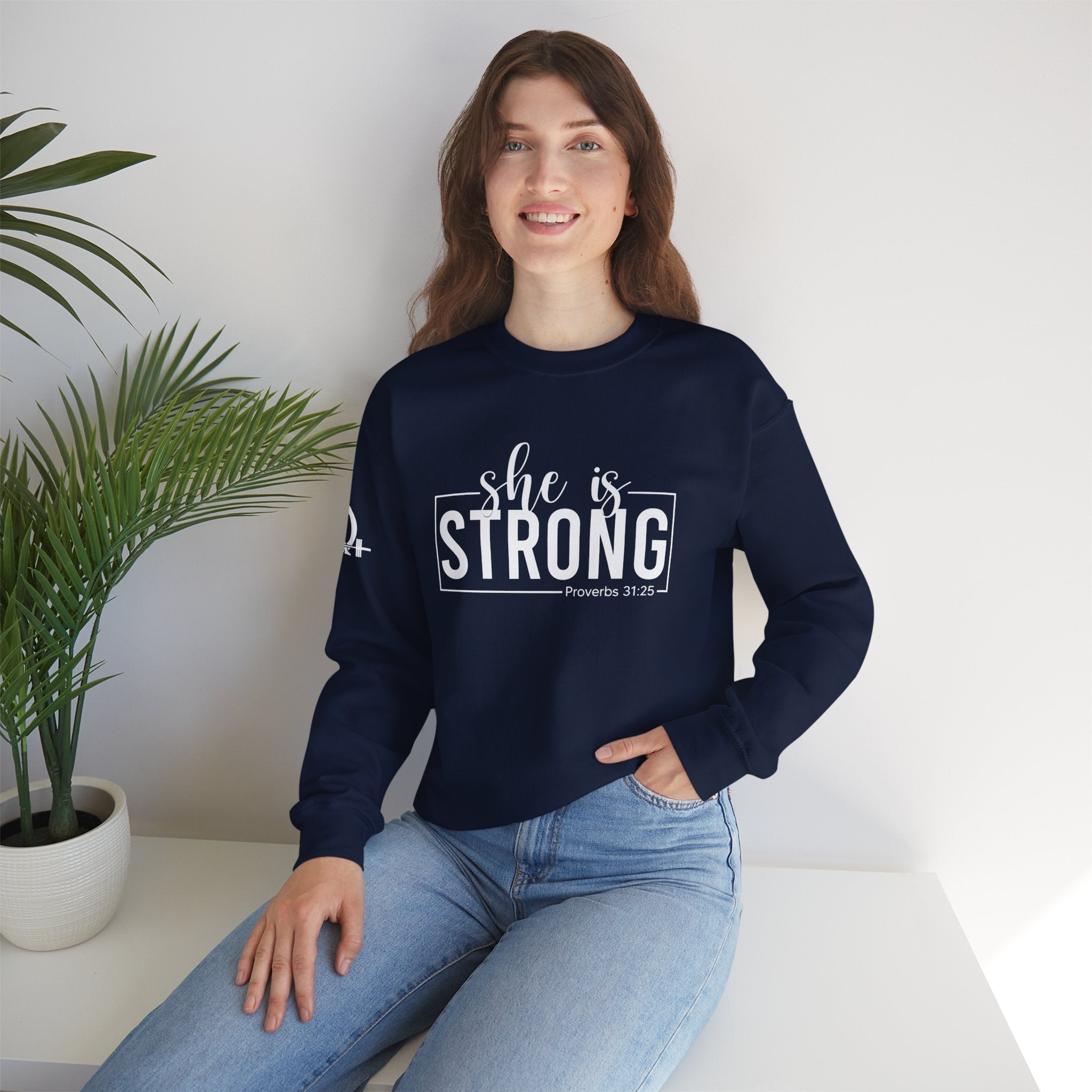 She is STRONG - Unisex Heavy Blend™ Crewneck Sweatshirt - Front White Logo - Plain Back