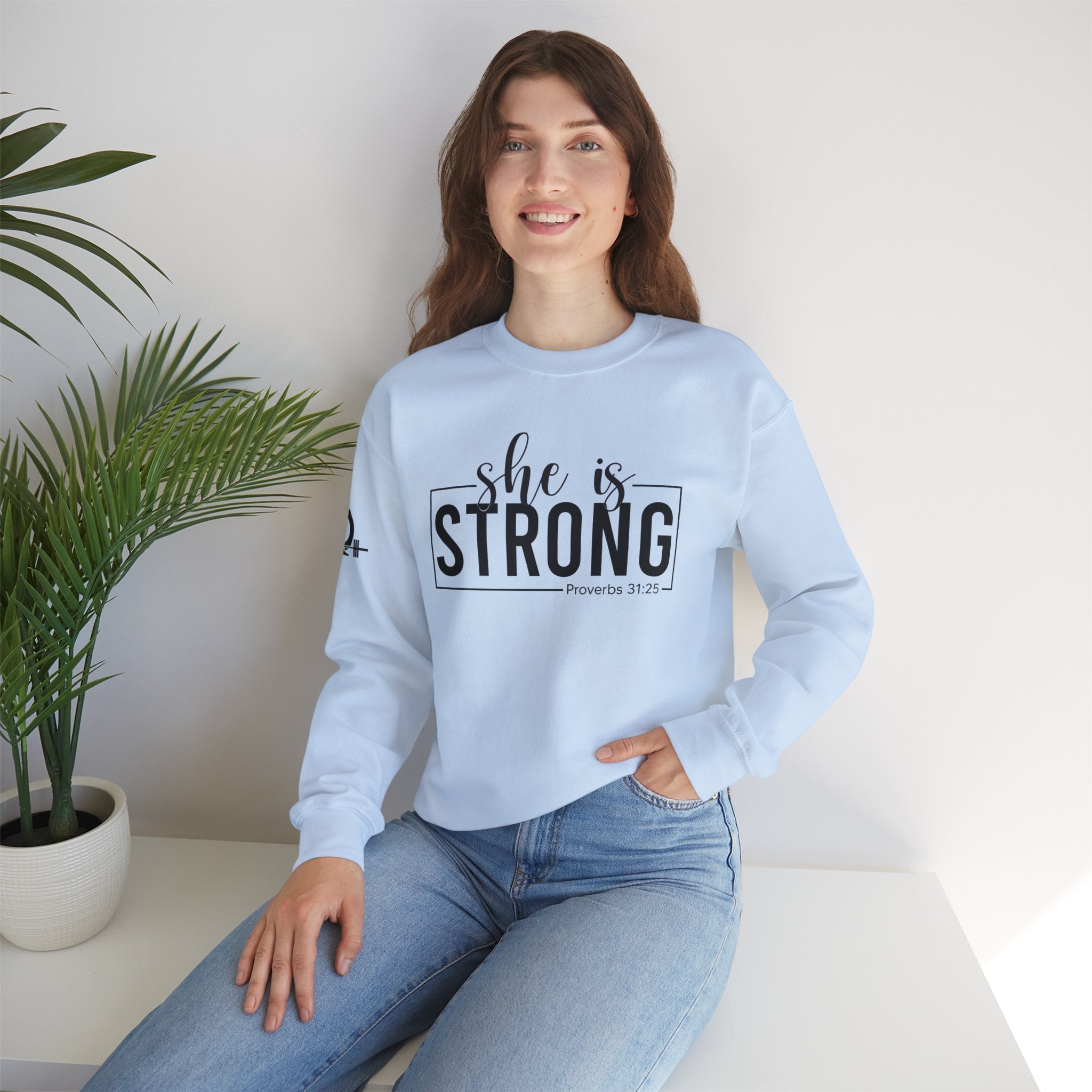 She is STRONG - Unisex Heavy Blend™ Crewneck Sweatshirt - Front Black Logo - Plain Back